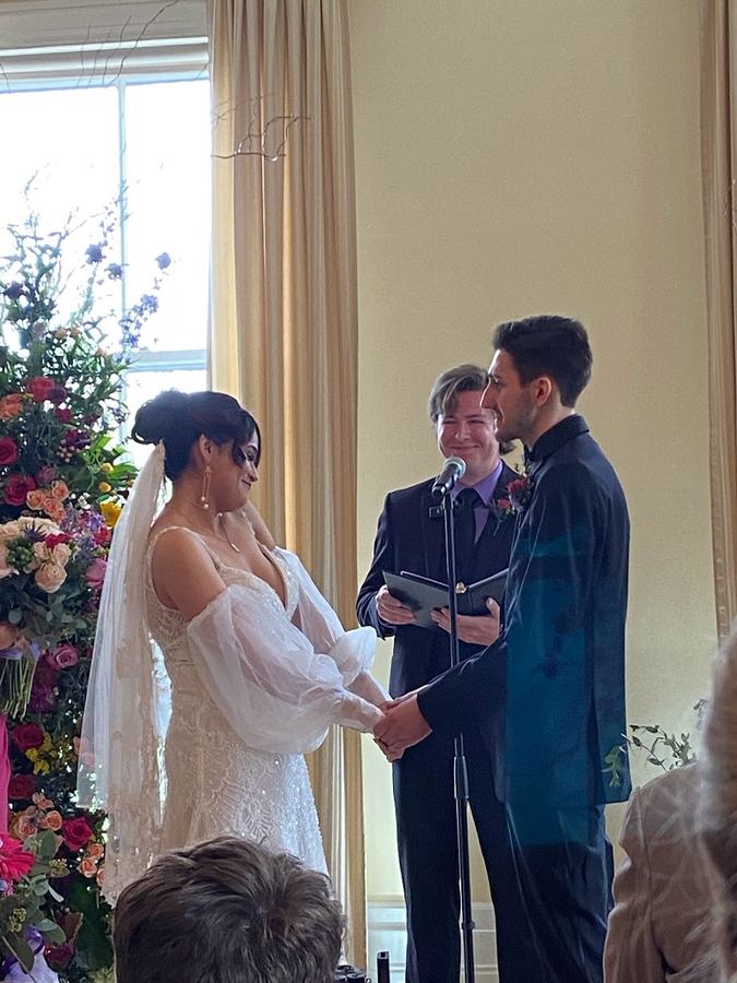 An indoor ceremony with the couple facing each other